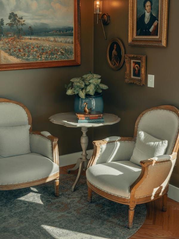 white-edwardian-chairs-table-with-books-plant